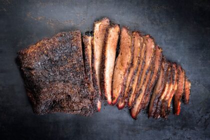 brisket sliced smoked black background